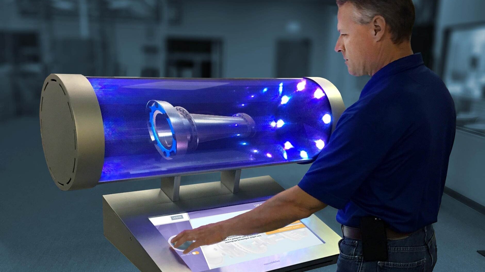 Close-up of the HoloTube kiosk: a lit tool hologram in the tube, a visitor's hand on the touch console