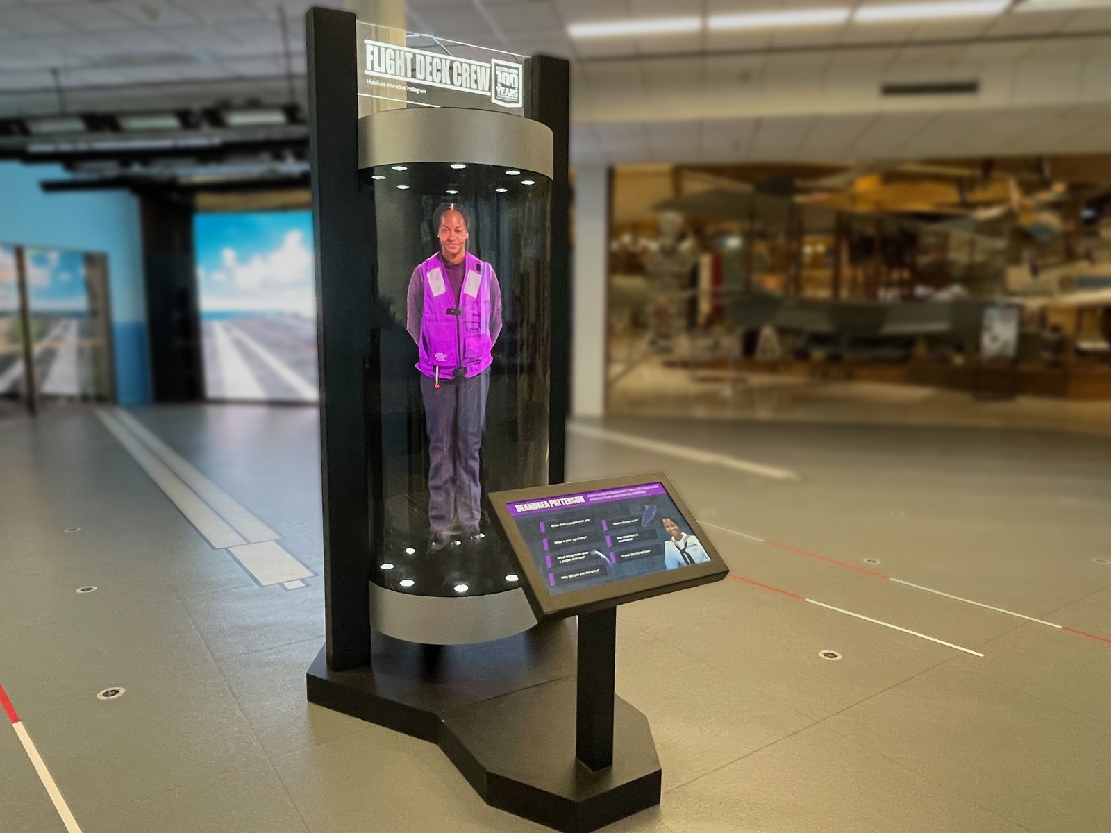A carrier crew member as a life-size hologram in a HoloTube at the National Naval Aviation Museum